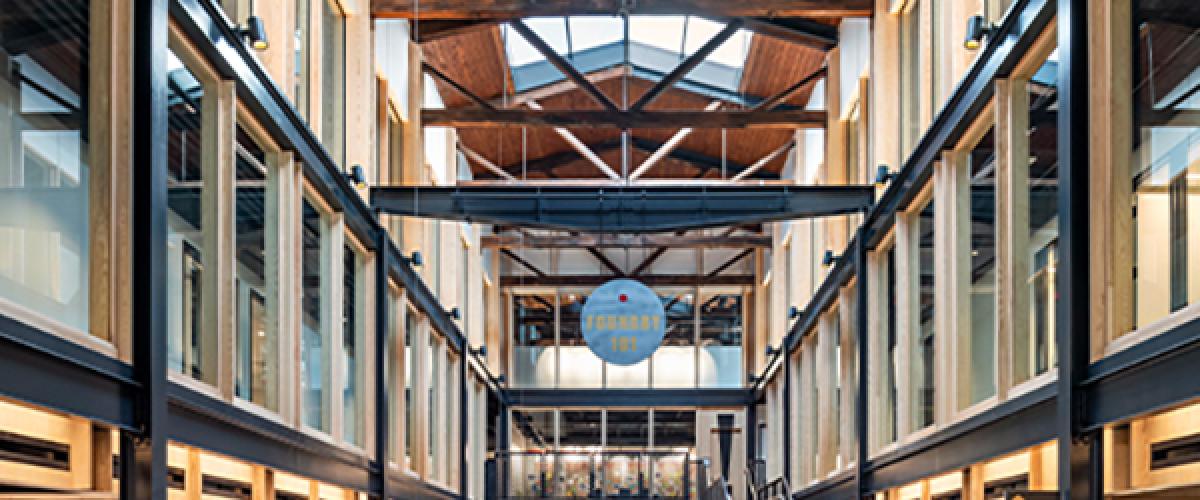 The Foundry's community hall showing windows into all three floors and skylights above