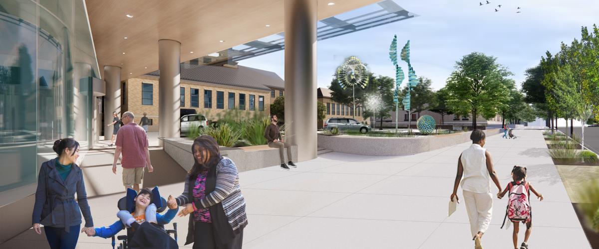 Rendering of the front entryway of a children's hospital campus. Wide walkways, greenery, and site sculptures dot the campus and a diverse array of patients enter and exit the building.